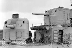 Forward gun turrets of USS David W. Taylor (DD-551) at Hunters Point Naval Shipyard, California (USA), on 23 April 1945.jpg