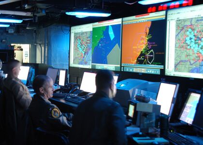 Joint Operations Center watch standers aboard the command ship USS Mount Whitney in the year 2005